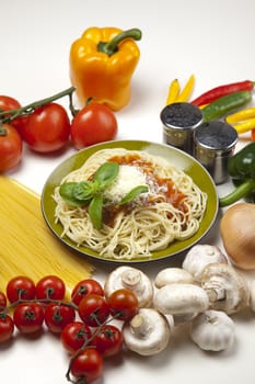 Pasta with tomato sauce basil and grated parmesan