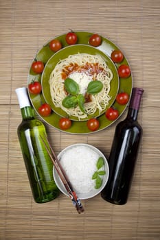 Pasta with tomato sauce basil and grated parmesan