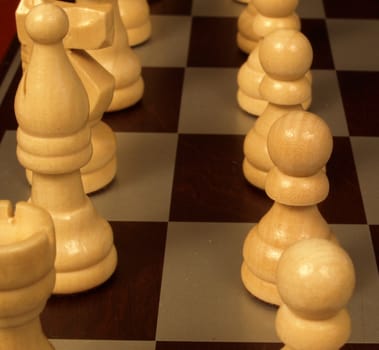 Upclose view of the chess pieces on a board