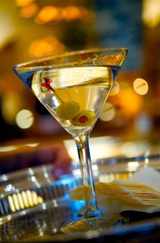 Close up image of a martini on a serving tray
