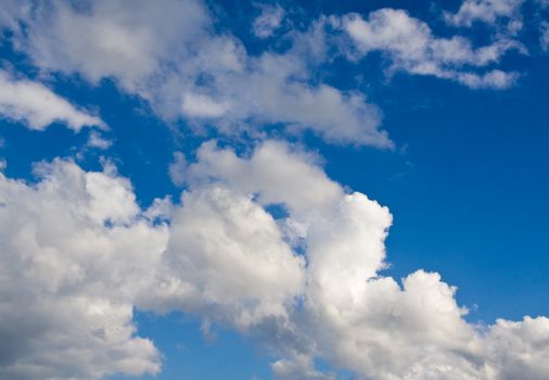 Blue sky and white clouds on sunny day. Horizontal