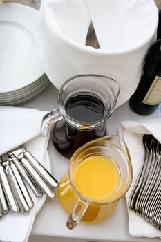 Two jugs with orange and cherry juice