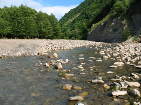 The river flows in mountains of Caucasus