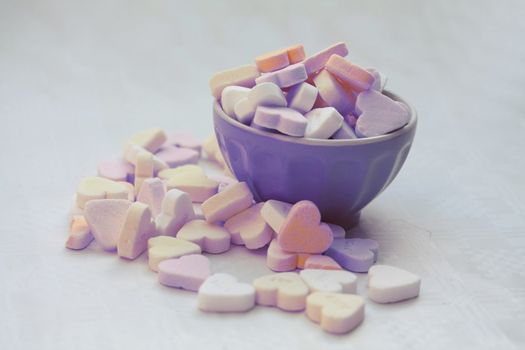 A bowl with heartshaped valentine candies