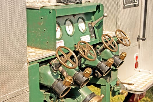 water valves at the rear of an old fire truck