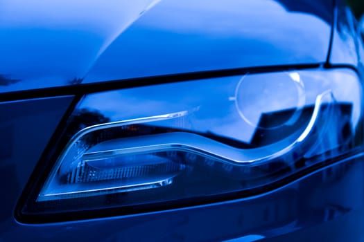 Detail of front light of a luxury car.