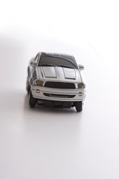 Toy sport car coming towards the camera