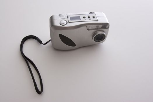 Small point and shoot digital camera with handle