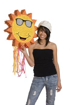 Teenage girl wearing a black tube top, knitted hat and jeans with holes holding a sunny pinata with great big smiles