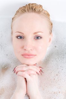 a  young woman to put out from foam water