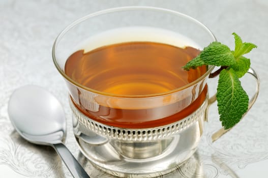 Cup of mint tea on a Moroccan silver tray