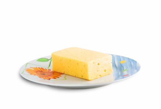 fresh and tasty slice of cheese on a colour plate, isolated