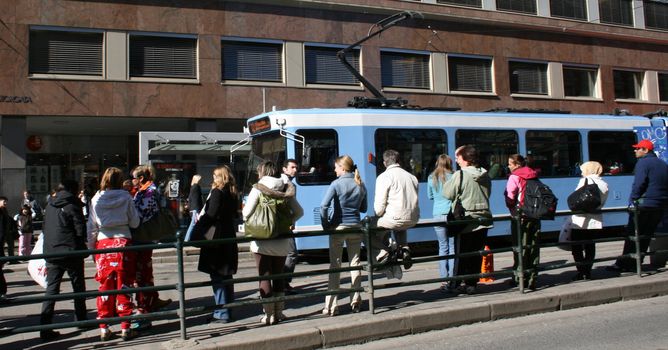 People waiting for the bus, public transportation, Storgata, Oslo. 