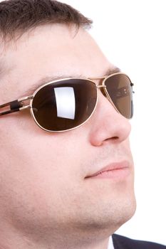 a strong man face with glasses looking out.Isolated in white.