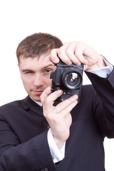 man is looking in old optical camera