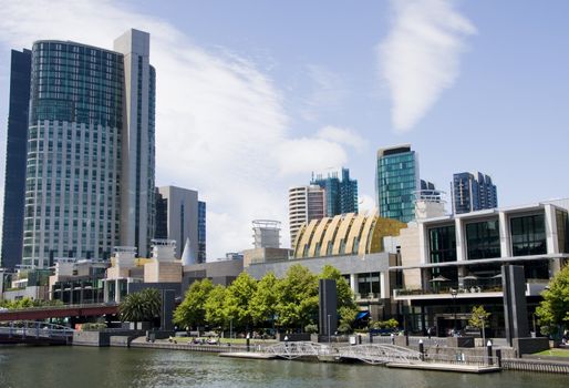 Melbourne boardwalk on yarra river downtown, with highrise.