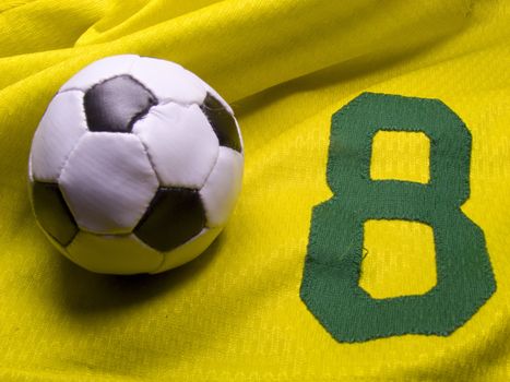 photo of the soccer ball over nuber eight uniform