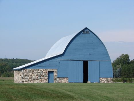 Blue barn with fieldstone foundation