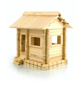 Wooden toy house on a white background. Isolated path included