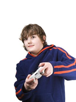 Young boy playing a video game with his tongue out