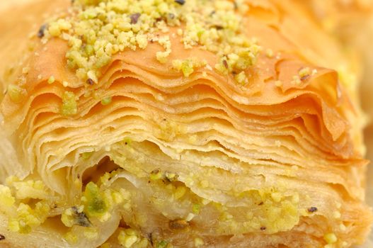 Macro of a fresh baklava with chopped pistachios