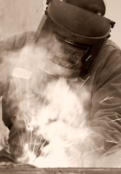 a welder working at shipyard during day
