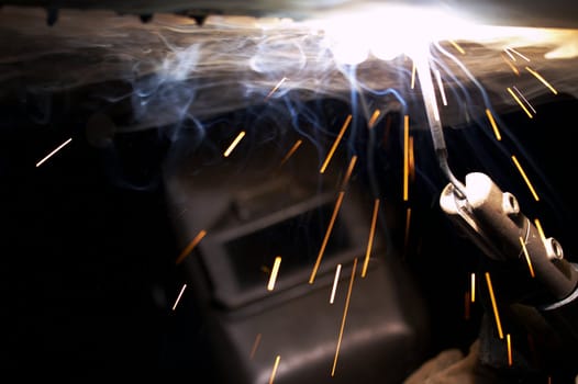 a welder at shipyard working at night