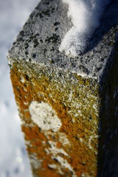 an old headstone in an ancient graveyard