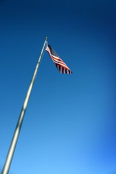an american flag with blue sky