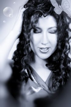 Fantasy? Nirvana? Hallucination? Utopia? Breathless, beautiful model with long locks of hair oozing emotion, blue tonings.