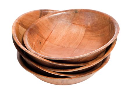 A stack of wooden bowls isolated against a white background