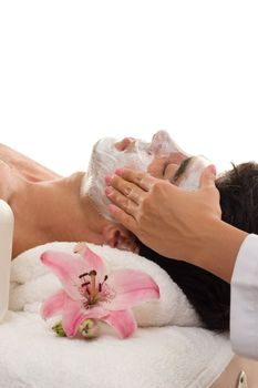 A man escapes the hustle and bustle of urban business life with a de-stressing trreatment at a day spa.   Male patronage at day spas has increased to over 20% of clientelle and this figure rises yearly.   Most popular male treatments are facial, massage, haircut, shave, and body waxing, 