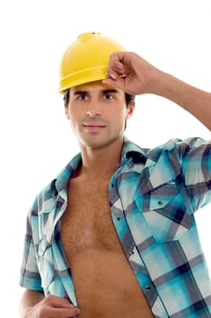 Builder, foreman,  or tradesmen wearing blue check shirt and yellow hard hat