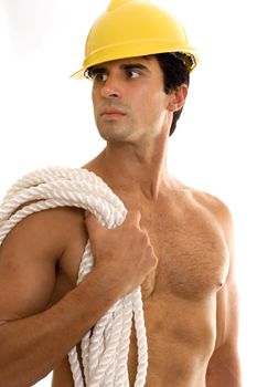 Builder wearing hard hat and carrying srope