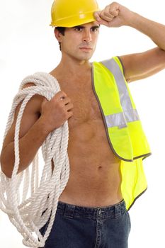 Construction worker carrying gear