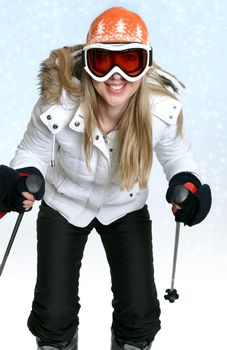 Female skier against a snowy backdrop