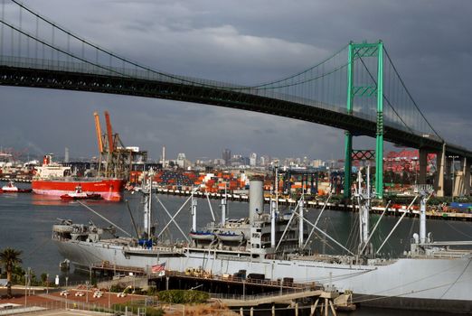 A bridge spans a busy port, active with trade and travel