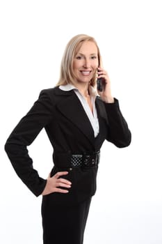 A smiling cheerful business woman using a mobile phone.