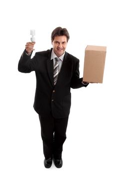 Think outside the box...  A business man balancing a box in one hand and holding an energy efficient light bulb in the other.     eg  ideas, lateral thinking, different perspective, unconventional,  eco  energy, innovation, environment related issues or challenges for business.