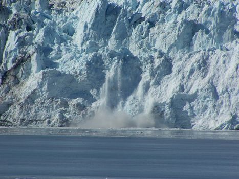 A chunk of ice calving off of Hubbard Glacier into Disenchantment Bay.  Taken off of the Alaska coast.