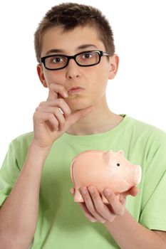 Pondering boy wearing a green t-shirt and holding a money box 
