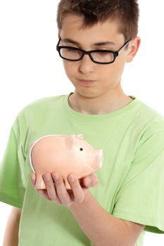 Boy wearing a green t-shirt ponders over a money box.