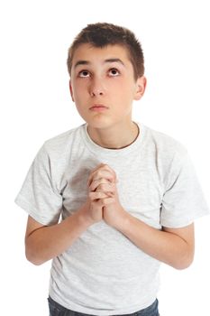 Boy with hands clasped in prayer looks to heaven God for answers