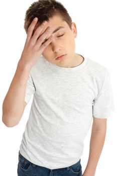 A boy with hand on forehead, headache, pain, tired, weary, depression