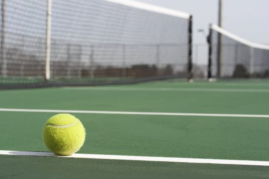 a picture of a tennis ball on the court