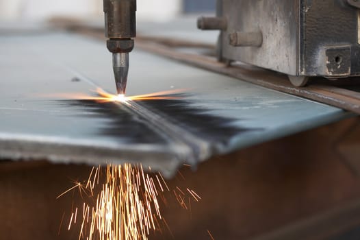 a close up of track torch burning steel