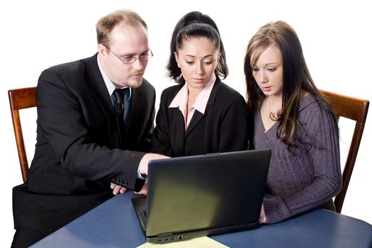 Team of young business professionals working on computer