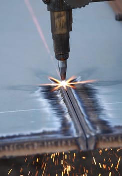 a close up of track torch burning steel