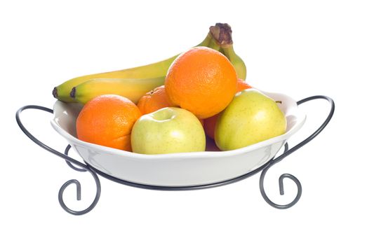 A platter of fruit consisting of oranges, bananas and apples, isolated against a white background