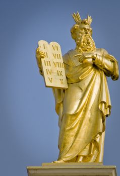 Golden Statue of Moses with 10 commandments in Bruges